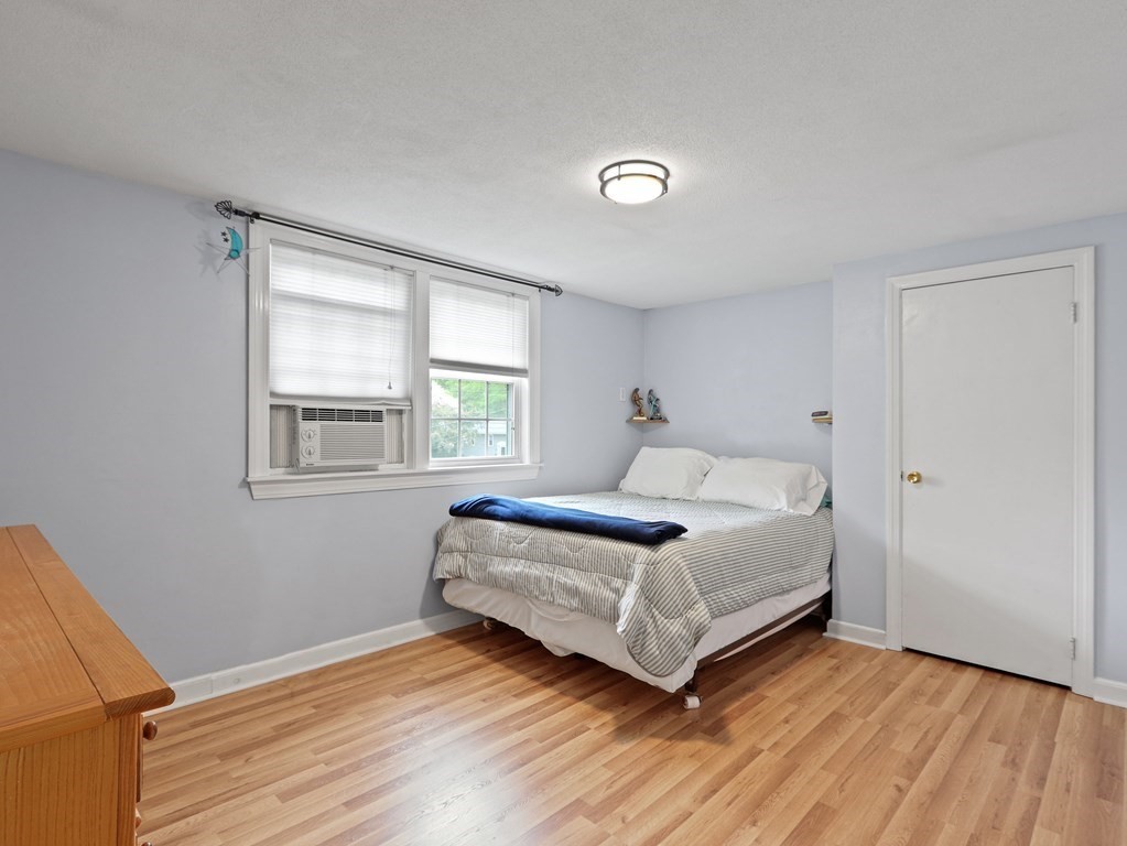 26 Elda Road Framingham, MA 01701 - Photo 12 of 27 a bedroom with a bed and a window