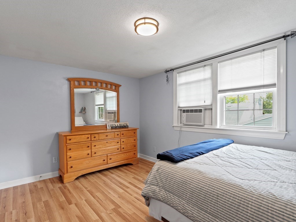 26 Elda Road Framingham, MA 01701 - Photo 13 of 27 a bedroom with a bed and a dresser