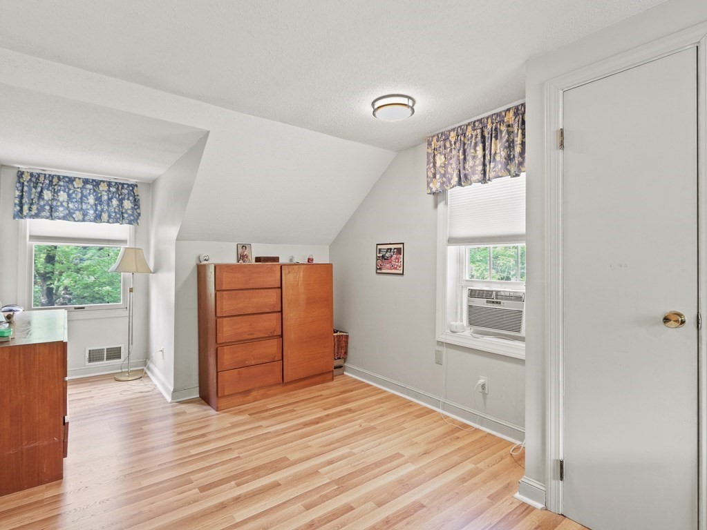 26 Elda Road Framingham, MA 01701 - Photo 15 of 27 an empty room with wooden floor cabinet and windows