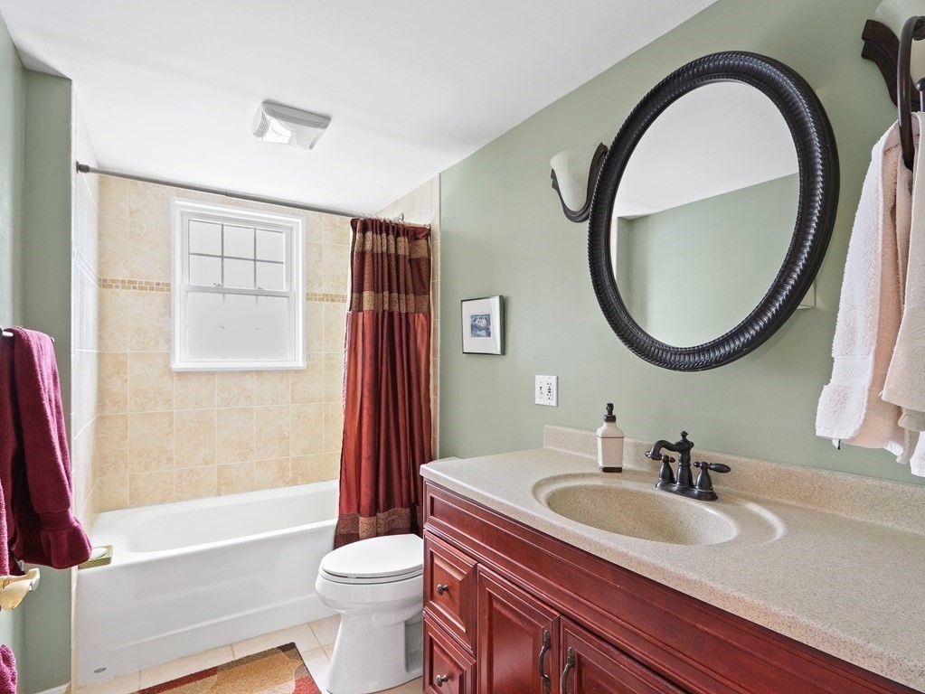 26 Elda Road Framingham, MA 01701 - Photo 16 of 27 a bathroom with a sink and a mirror