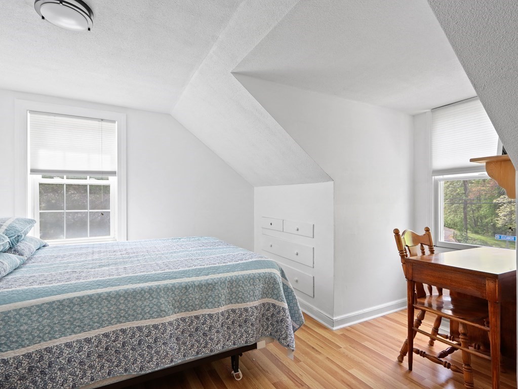 26 Elda Road Framingham, MA 01701 - Photo 17 of 27 a bedroom with a bed and a table