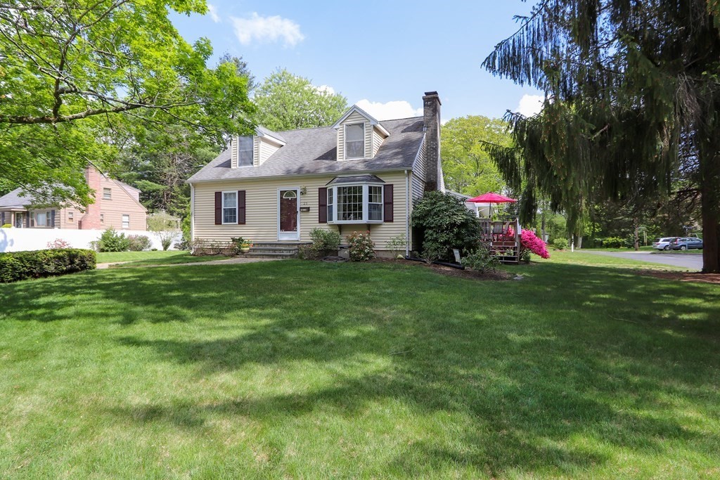 26 Elda Road Framingham, MA 01701 - Photo 19 of 27 a front view of house with yard and green space