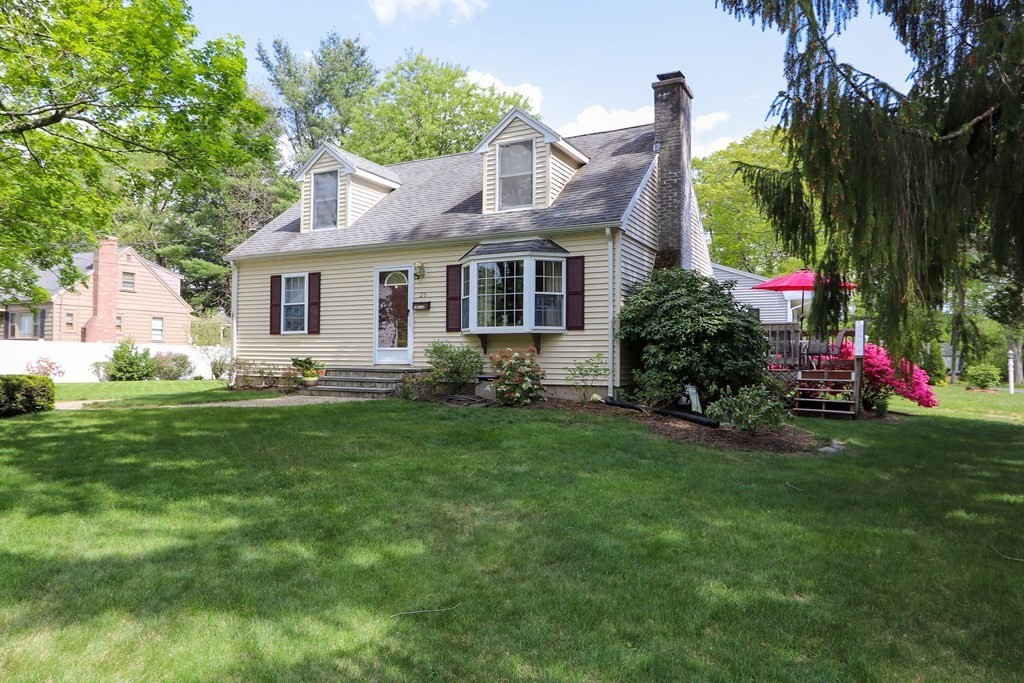 26 Elda Road Framingham, MA 01701 - Photo 20 of 27 a front view of house with yard and green space