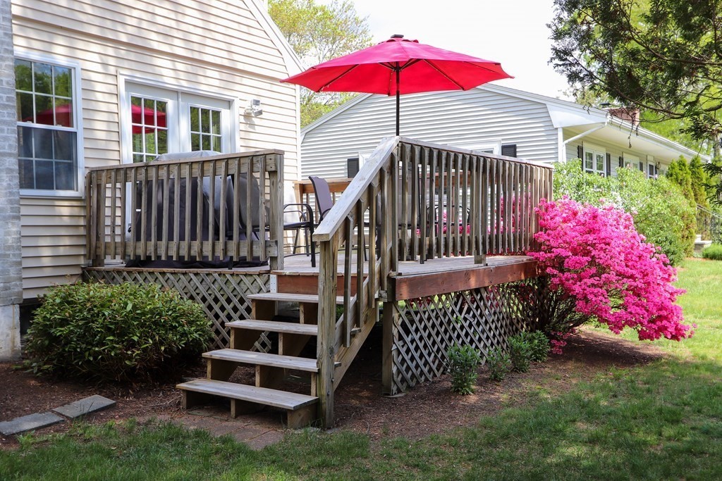 26 Elda Road Framingham, MA 01701 - Photo 21 of 27 a view of a house with a yard and a fence