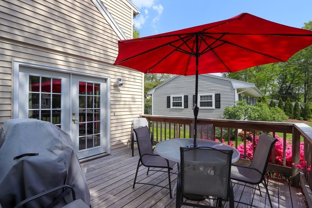 26 Elda Road Framingham, MA 01701 - Photo 23 of 27 a view of a chair and table on the deck