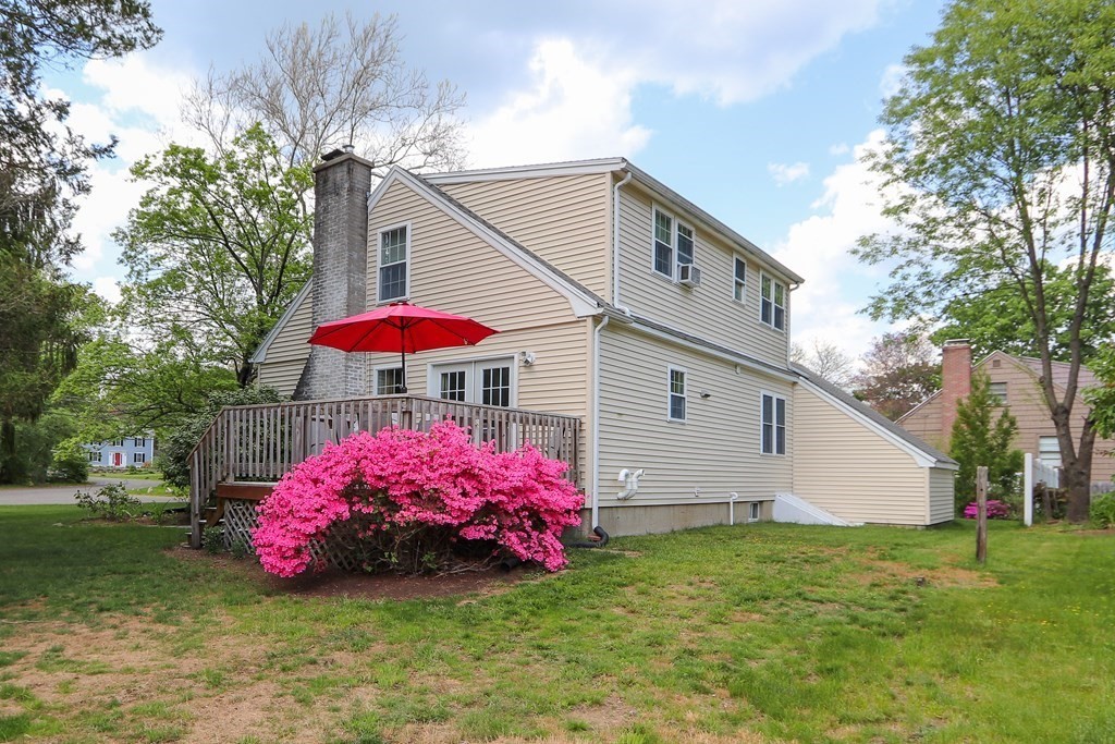 26 Elda Road Framingham, MA 01701 - Photo 25 of 27 a view of a house with a yard and potted plants