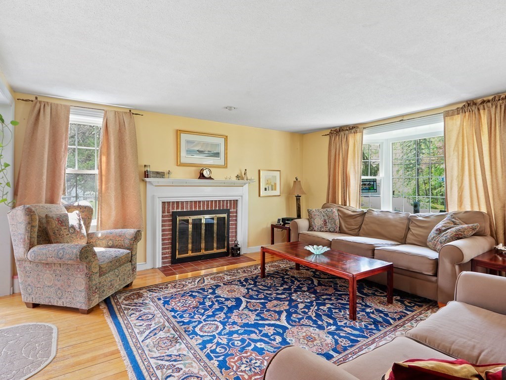 26 Elda Road Framingham, MA 01701 - Photo 3 of 27 a living room with furniture and a fireplace