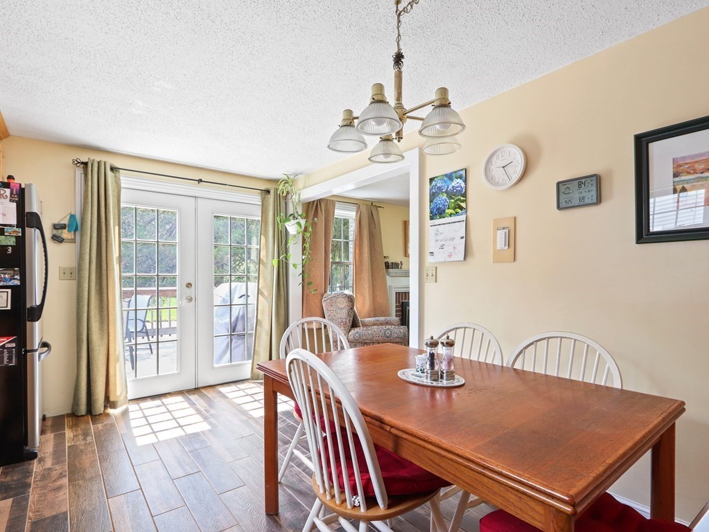 26 Elda Road Framingham, MA 01701 - Photo 7 of 27 a view of a dining room with furniture window and outside view