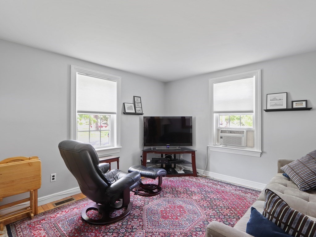 26 Elda Road Framingham, MA 01701 - Photo 8 of 27 a living room with furniture and a flat screen tv