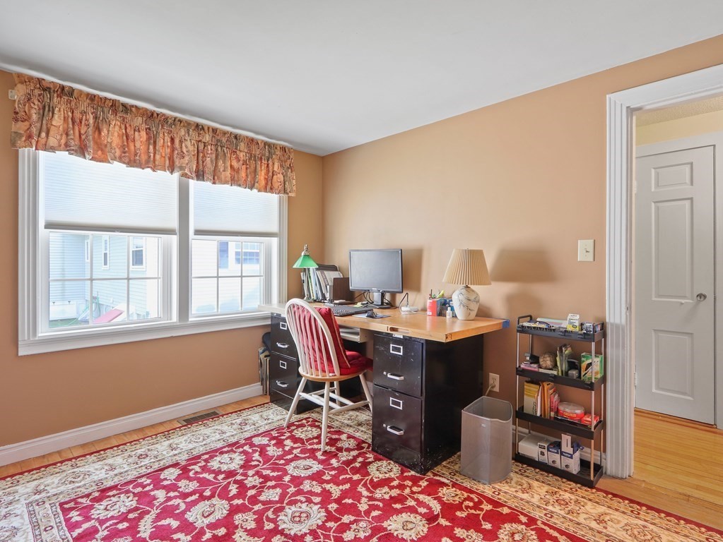 26 Elda Road Framingham, MA 01701 - Photo 9 of 27 a view of a workspace with furniture and a window