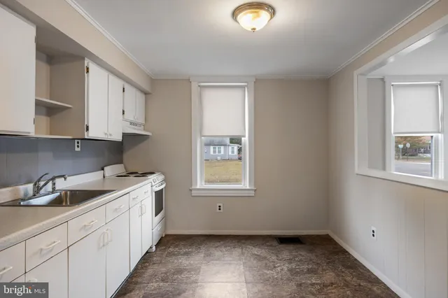 a kitchen with a sink and cabinets