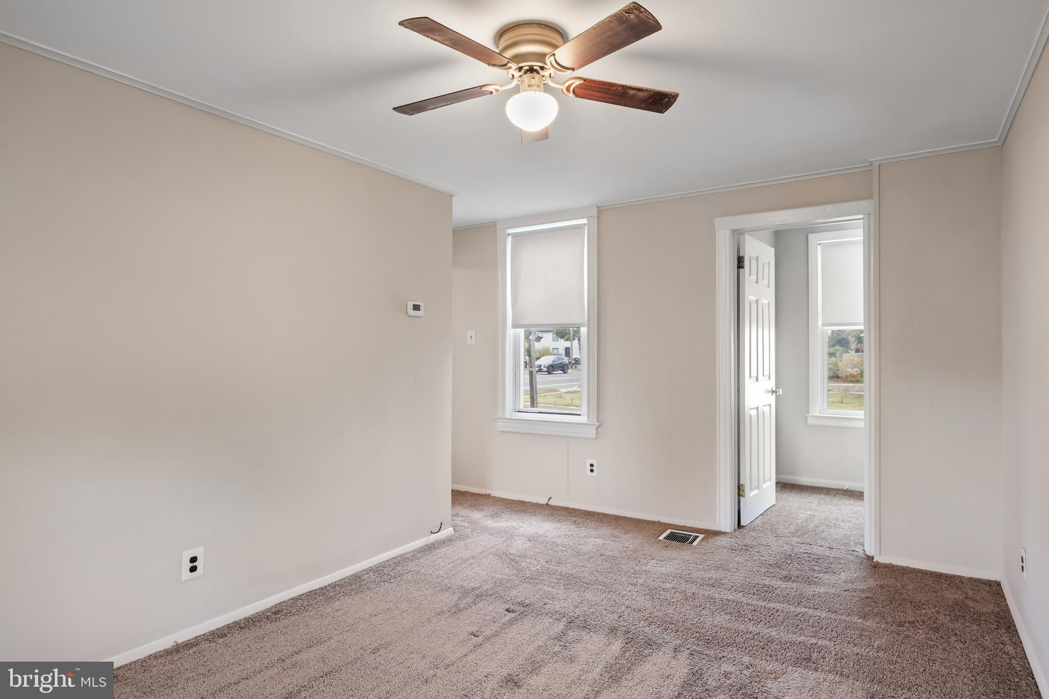 1500 Mt Holly Road, Unit 1F Burlington, NJ 08016 - Photo 19 of 21 an empty room with closet and a chandelier fan