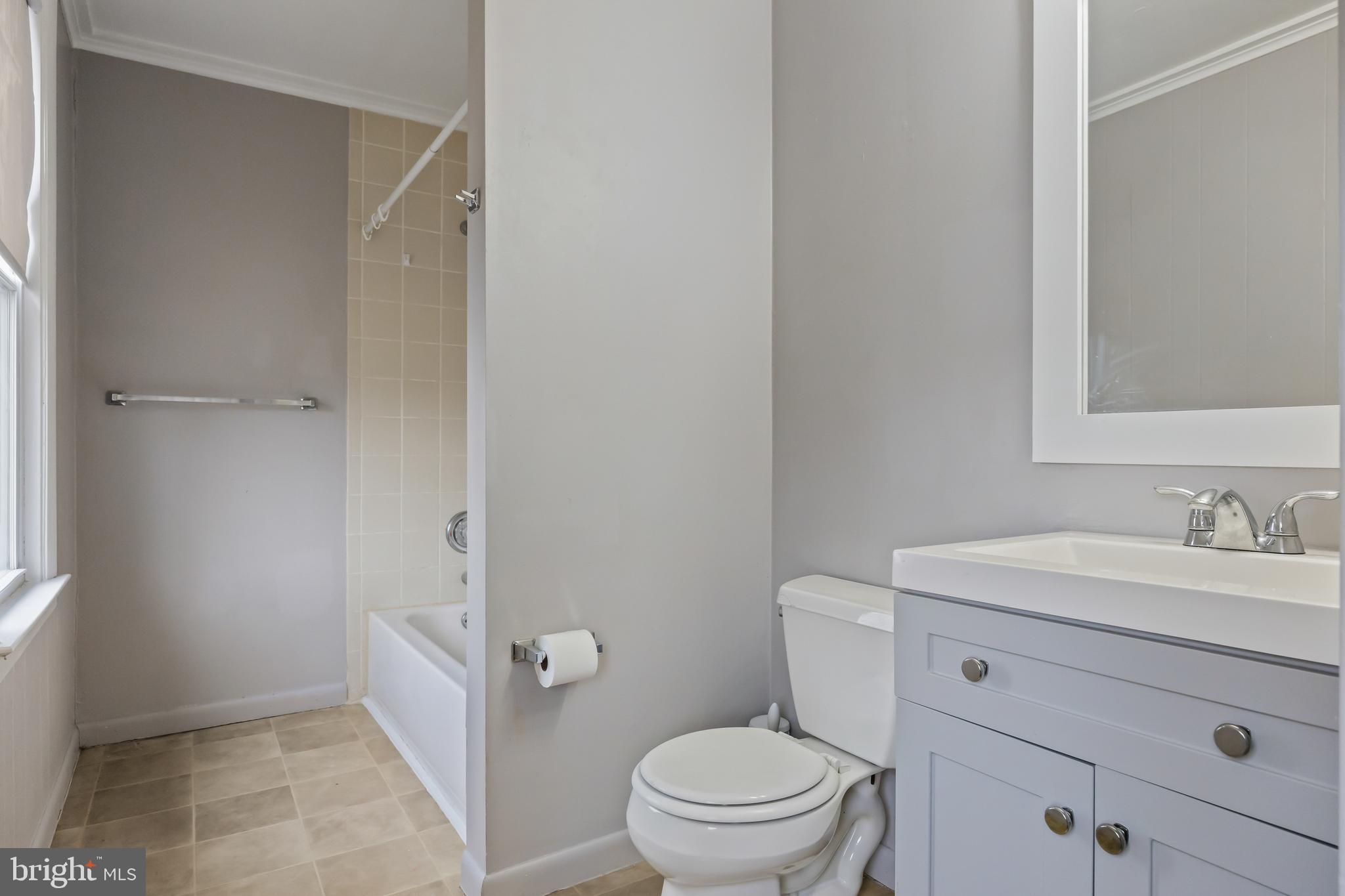 1500 Mt Holly Road, Unit 1F Burlington, NJ 08016 - Photo 20 of 21 a bathroom with a sink a toilet a vanity and mirror