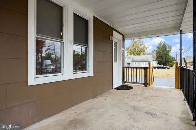 a view of balcony and a floor to ceiling window