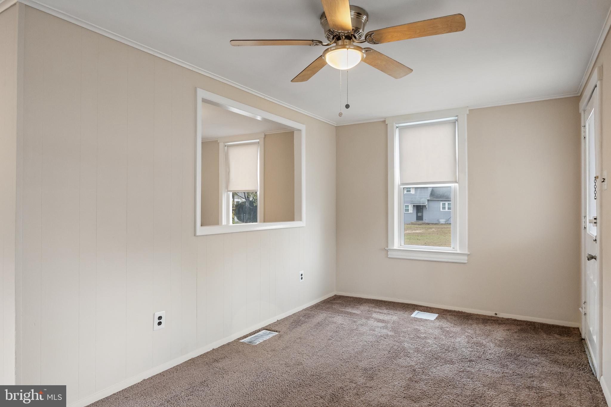 1500 Mt Holly Road, Unit 1F Burlington, NJ 08016 - Photo 9 of 21 an empty room with windows and fan