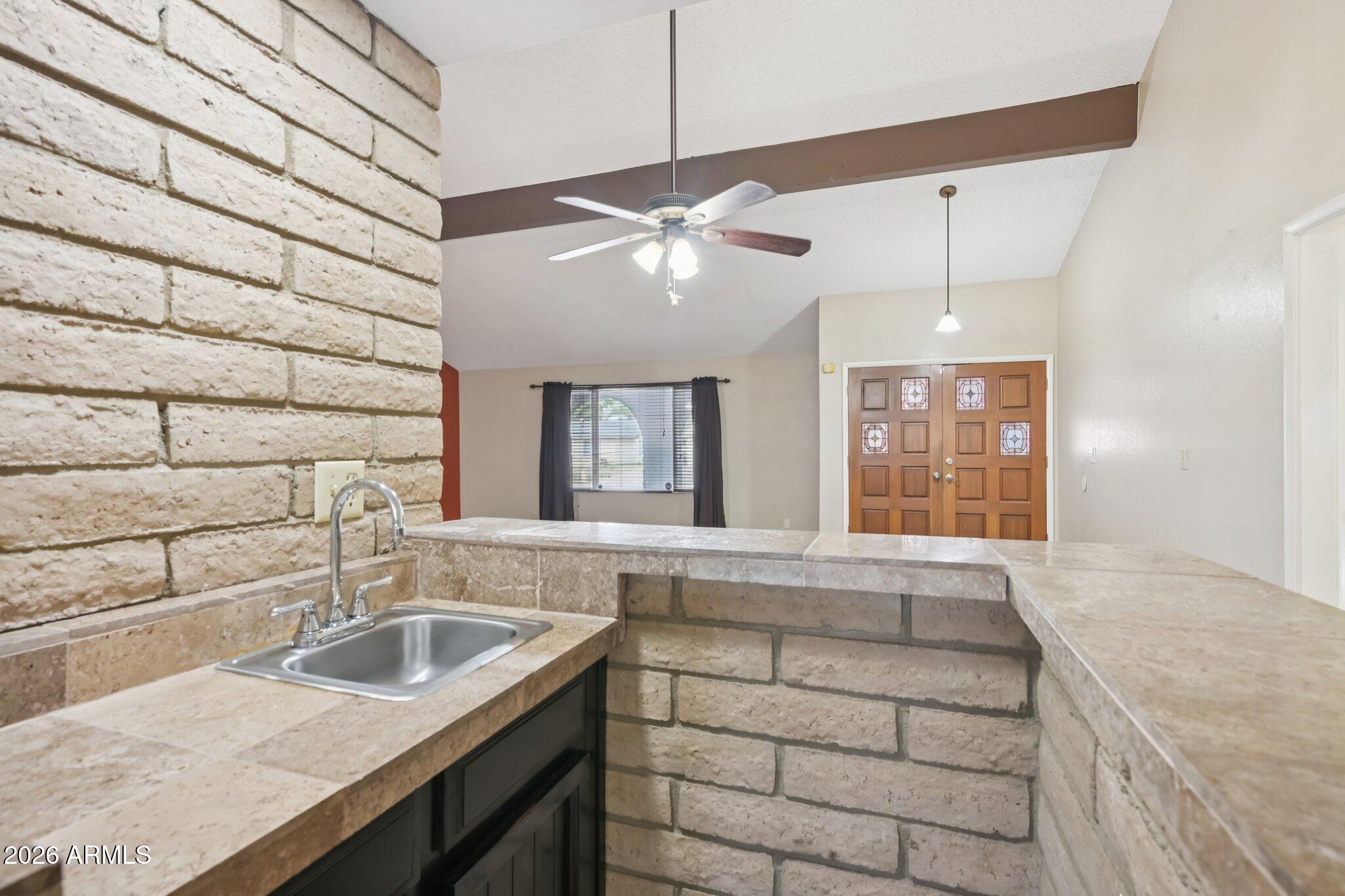 2201 West Utopia Road Phoenix, AZ 85027 - Photo 14 of 50 a kitchen with a sink cabinets and window