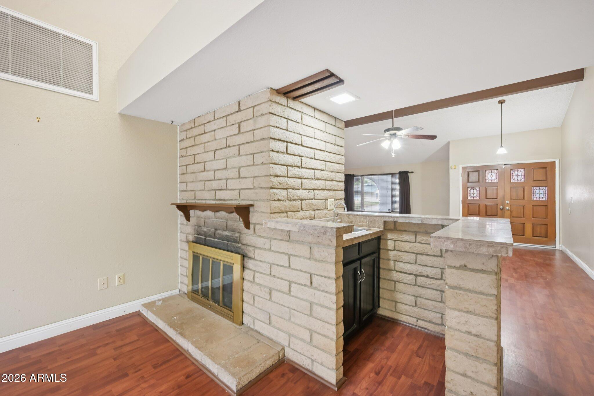 2201 West Utopia Road Phoenix, AZ 85027 - Photo 15 of 50 a living room with furniture and a fireplace