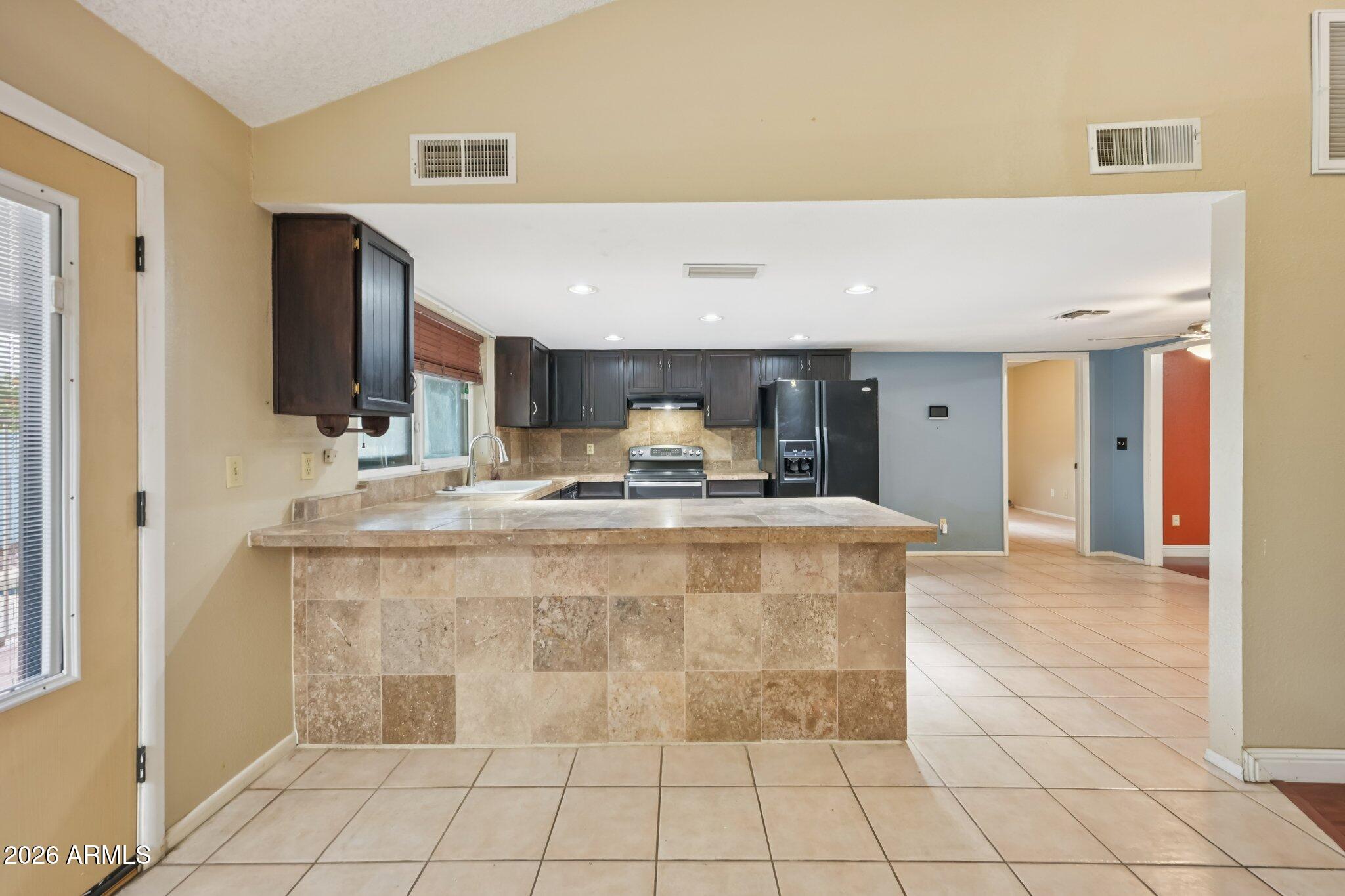 2201 West Utopia Road Phoenix, AZ 85027 - Photo 19 of 50 a view of living room with granite countertop furniture and fireplace