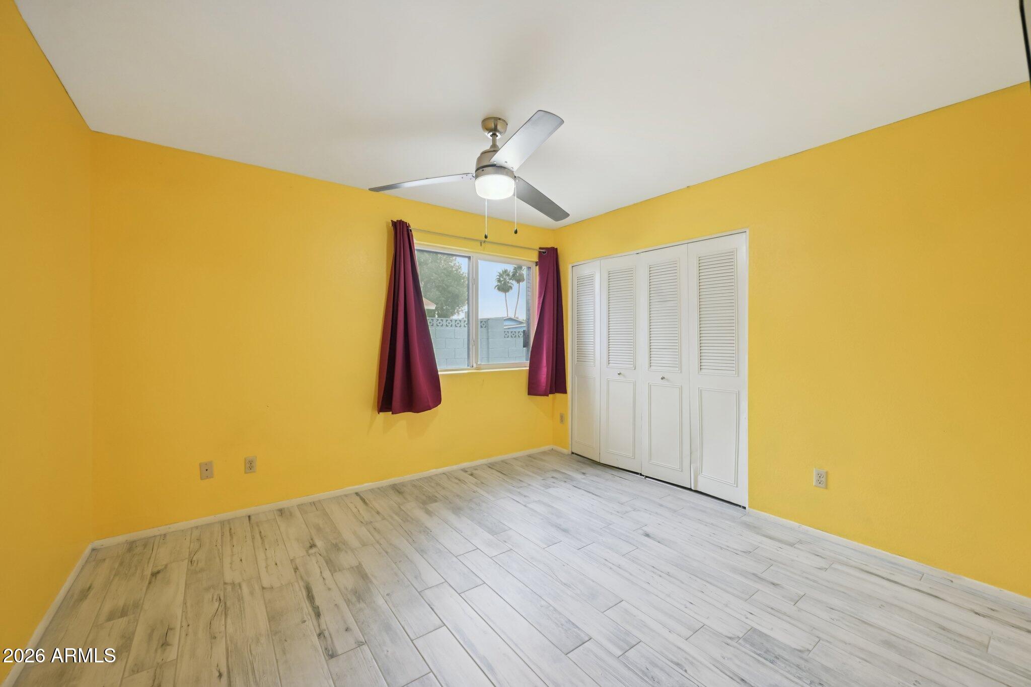 2201 West Utopia Road Phoenix, AZ 85027 - Photo 27 of 50 a view of empty room with wooden floor