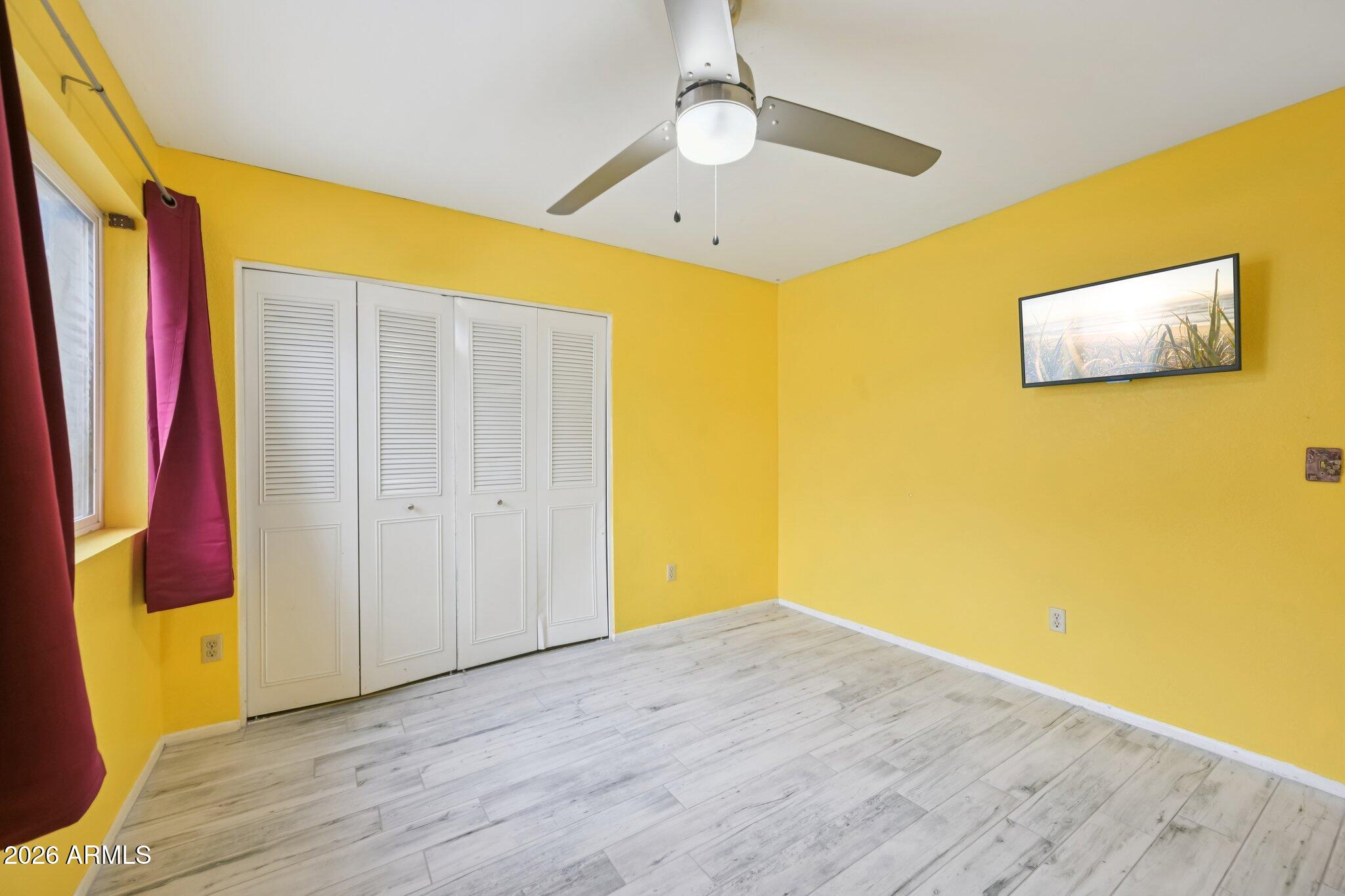 2201 West Utopia Road Phoenix, AZ 85027 - Photo 28 of 50 a view of a big room with wooden floor and windows