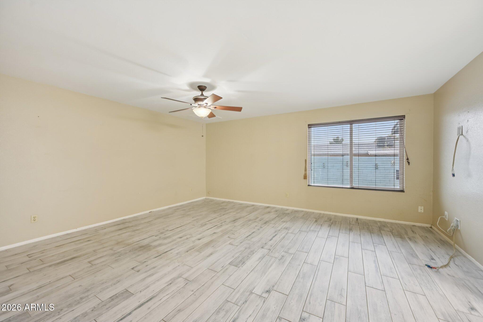 2201 West Utopia Road Phoenix, AZ 85027 - Photo 29 of 50 wooden floor in an empty room with a window
