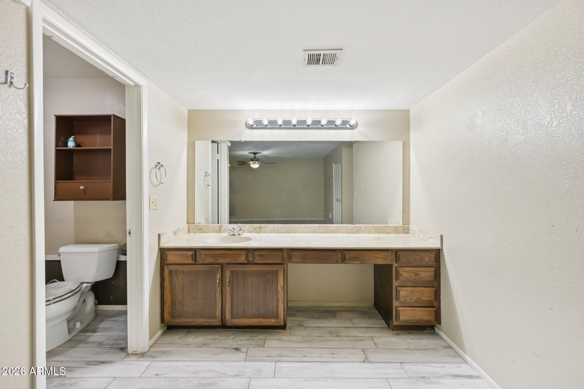 2201 West Utopia Road Phoenix, AZ 85027 - Photo 33 of 50 a bathroom with a sink and a mirror