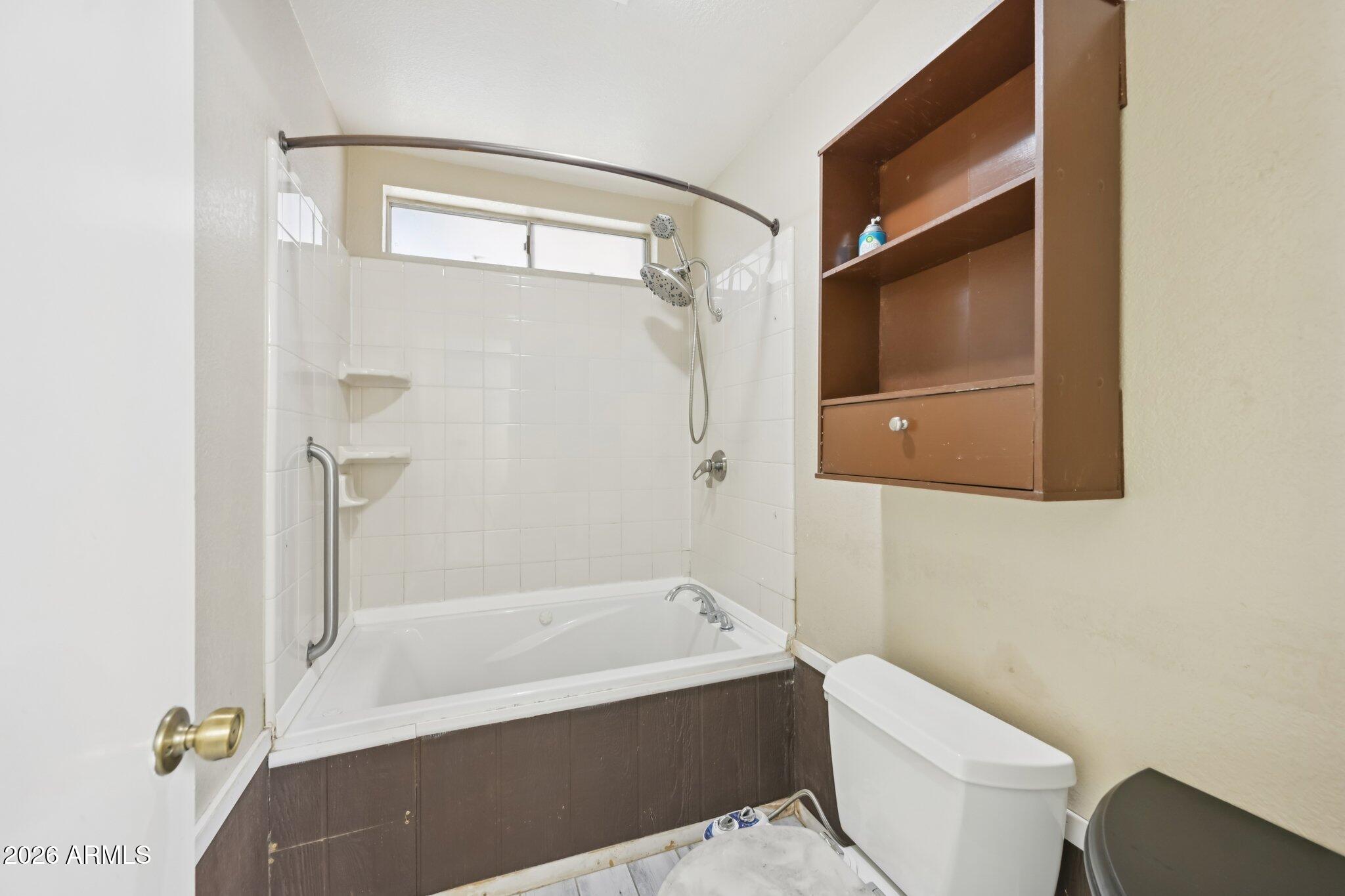 2201 West Utopia Road Phoenix, AZ 85027 - Photo 34 of 50 a bathroom with a toilet and a bathtub