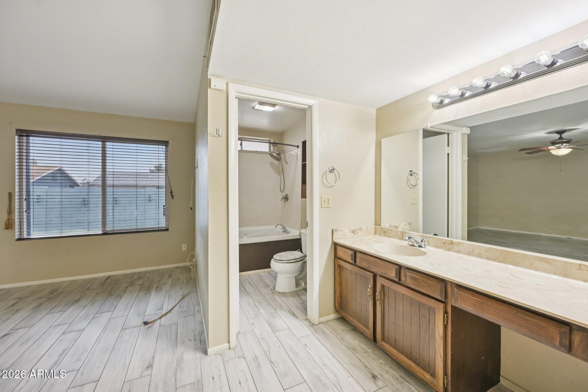 2201 West Utopia Road Phoenix, AZ 85027 - Photo 35 of 50 a spacious bathroom with a double vanity sink and a mirror
