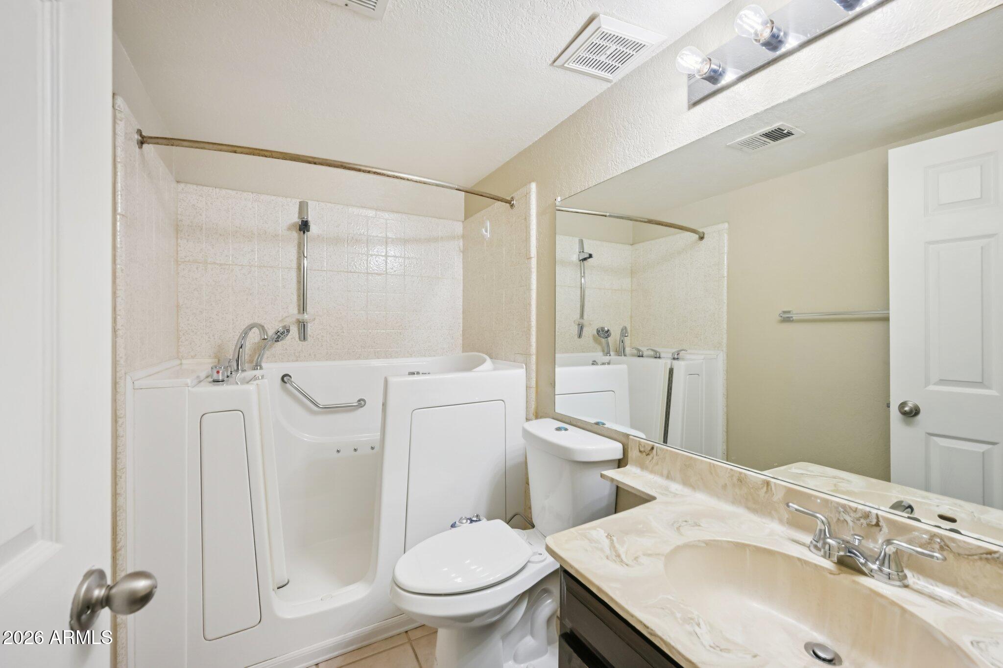 2201 West Utopia Road Phoenix, AZ 85027 - Photo 36 of 50 a bathroom with a sink toilet and shower