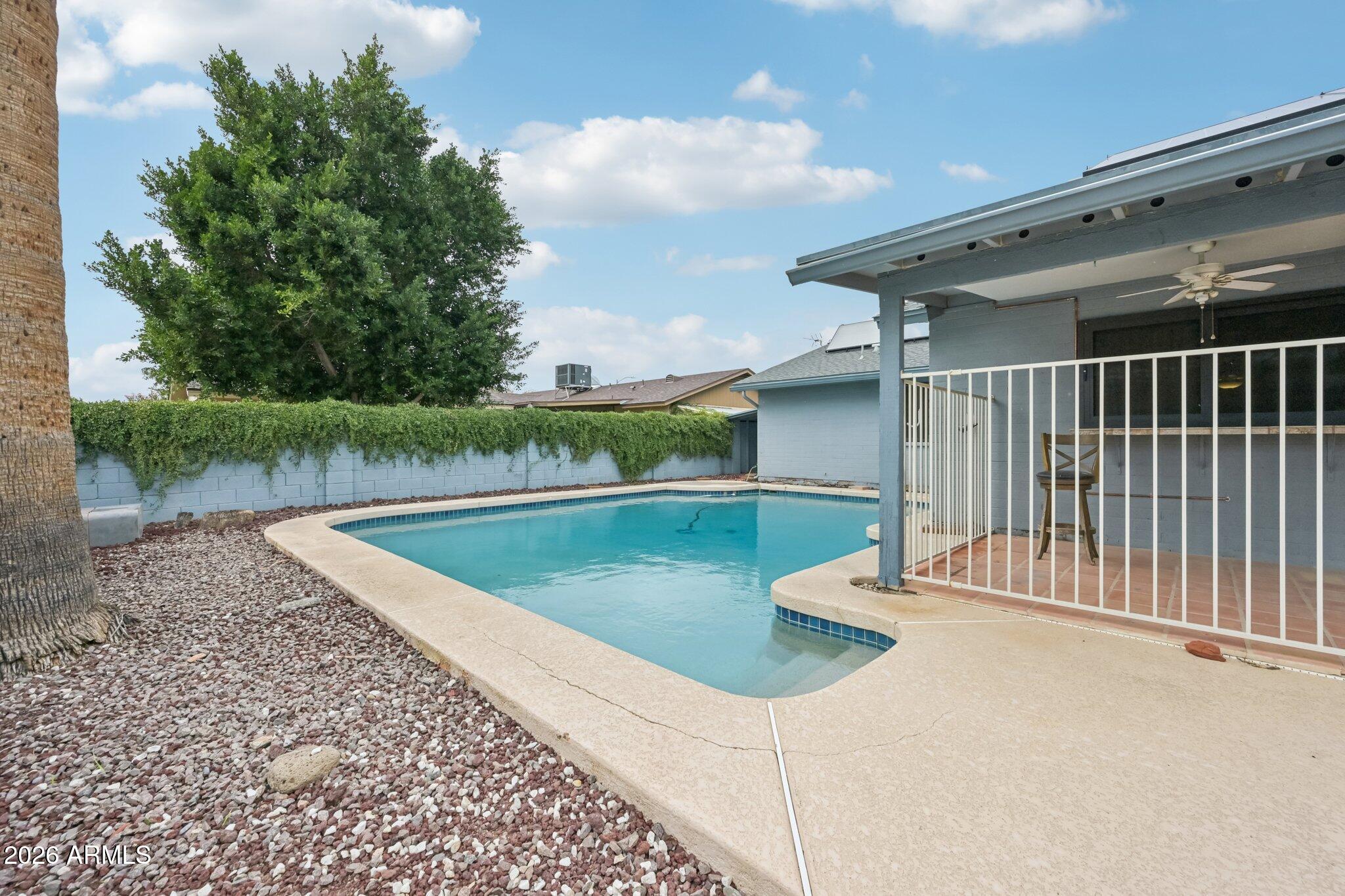 2201 West Utopia Road Phoenix, AZ 85027 - Photo 47 of 50 a view of a swimming pool with a backyard