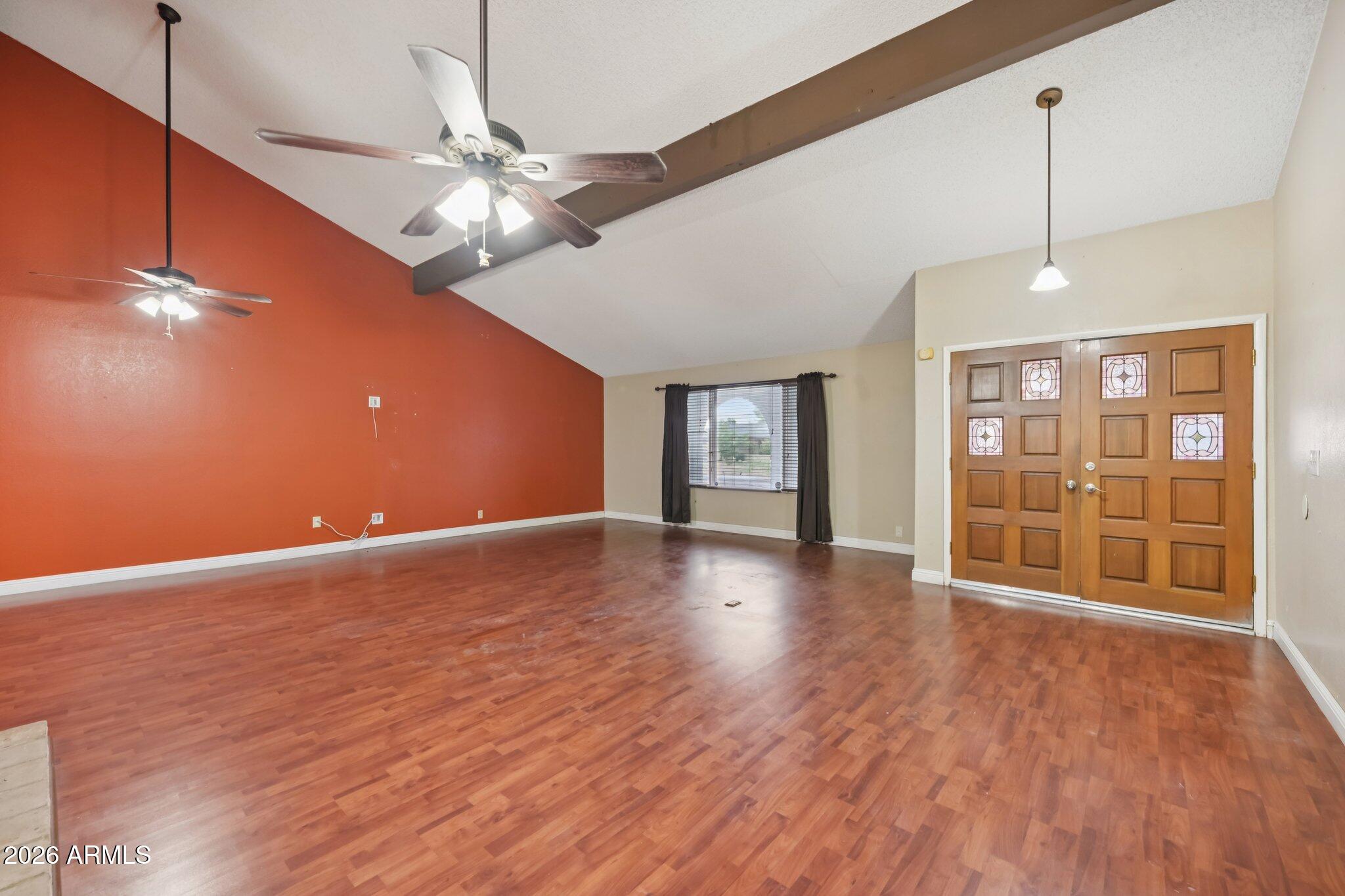 2201 West Utopia Road Phoenix, AZ 85027 - Photo 6 of 50 a view of an empty room with window and wooden floor