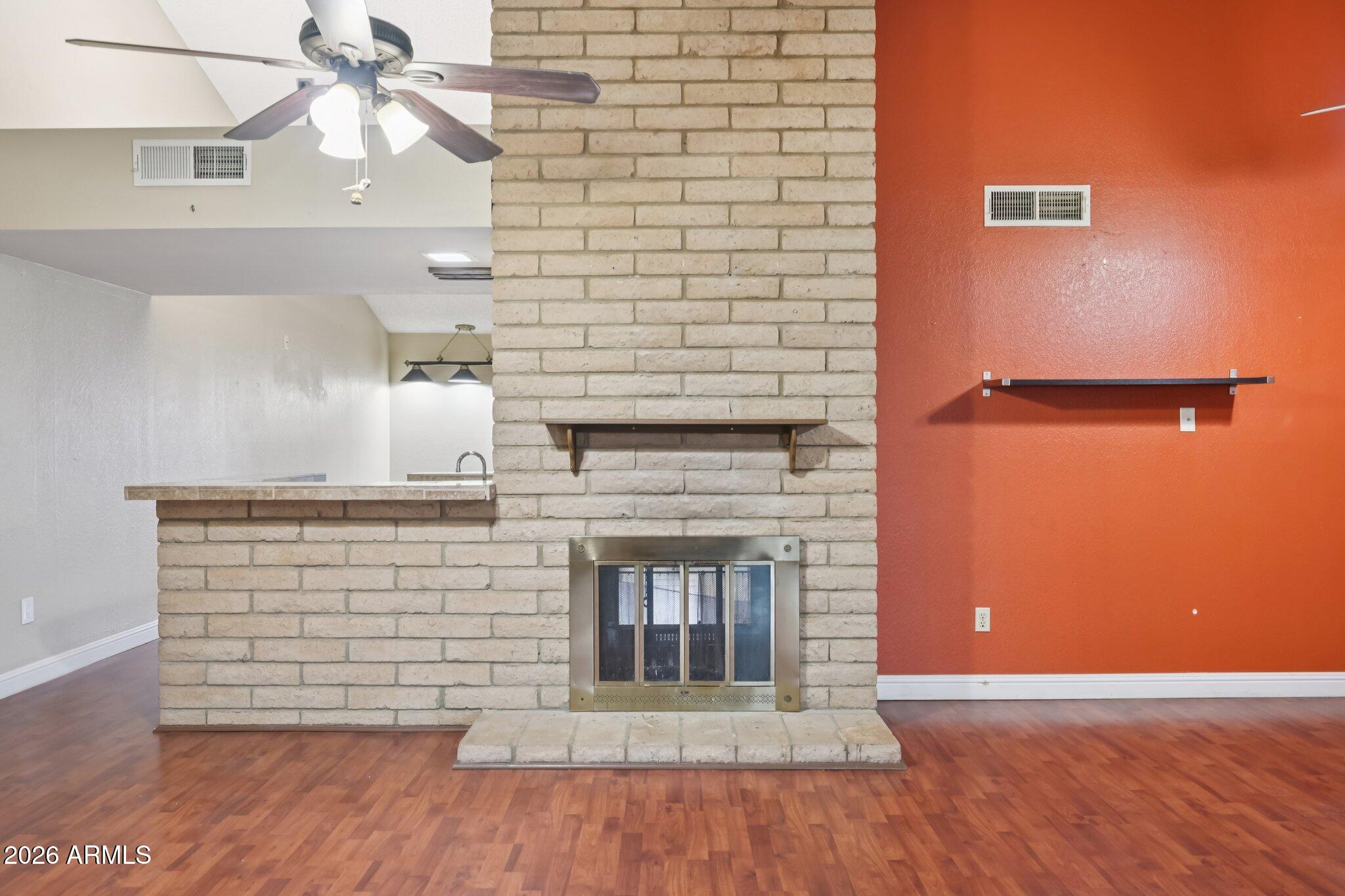2201 West Utopia Road Phoenix, AZ 85027 - Photo 10 of 50 a view of a fireplace with wooden floor