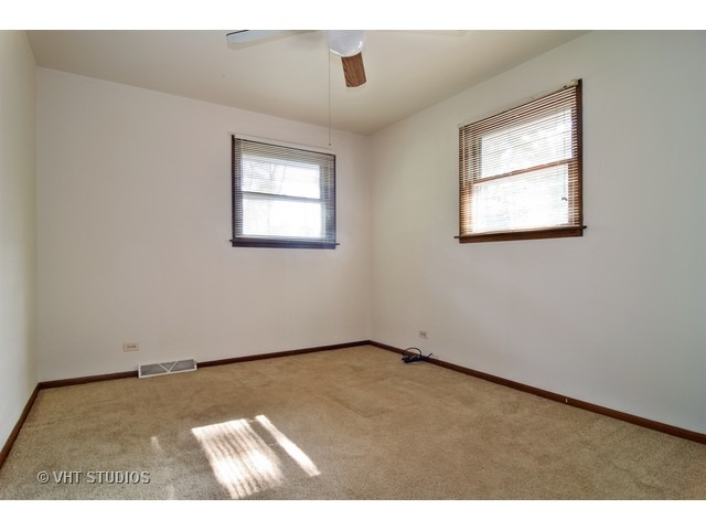 21 West 702 Lydia Road Addison, IL 60101 - Photo 5 of 10 an empty room with a window