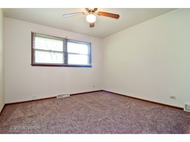21 West 702 Lydia Road Addison, IL 60101 - Photo 6 of 10 a view of an empty room with ceiling fan