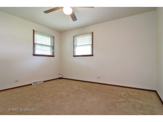 21 West 702 Lydia Road Addison, IL 60101 - Photo 8 of 10 a view of an empty room with a window