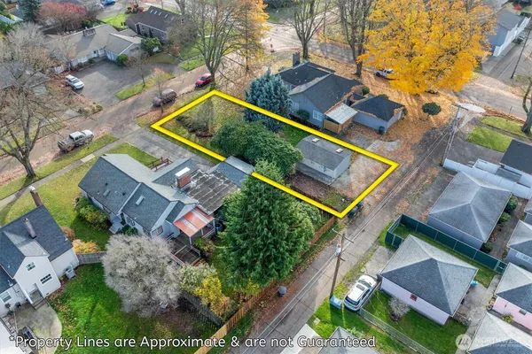 an aerial view of a house with a yard