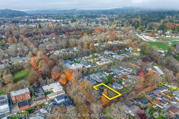 an aerial view of residential house with outdoor space and swimming pool