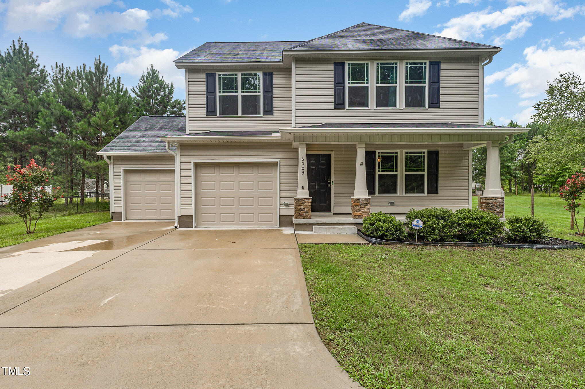6005 Zacks Mill Road Angier, NC 27501 - Photo 1 of 23 a front view of a house with a yard and garage