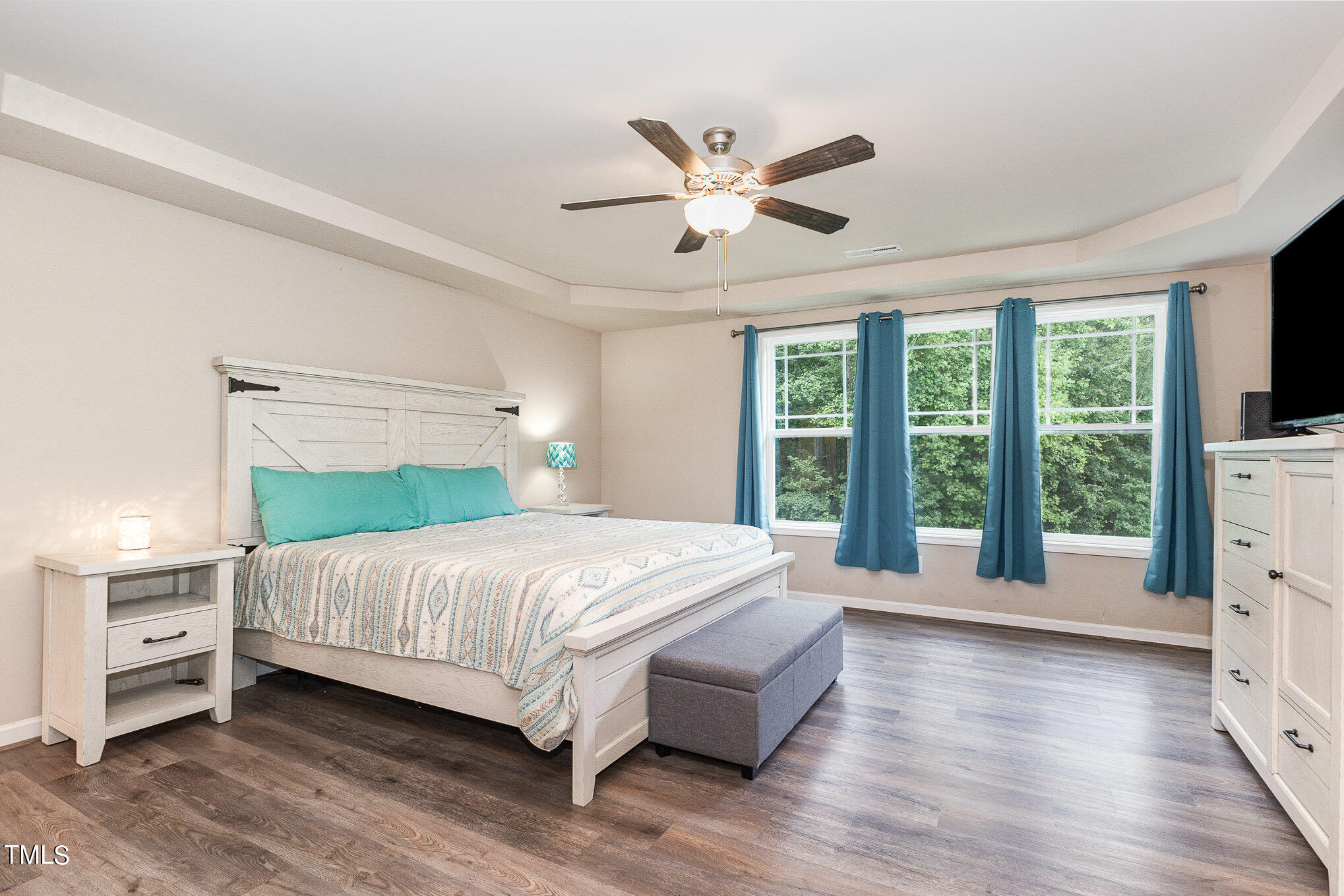 6005 Zacks Mill Road Angier, NC 27501 - Photo 12 of 23 a bedroom with a large bed and a large window