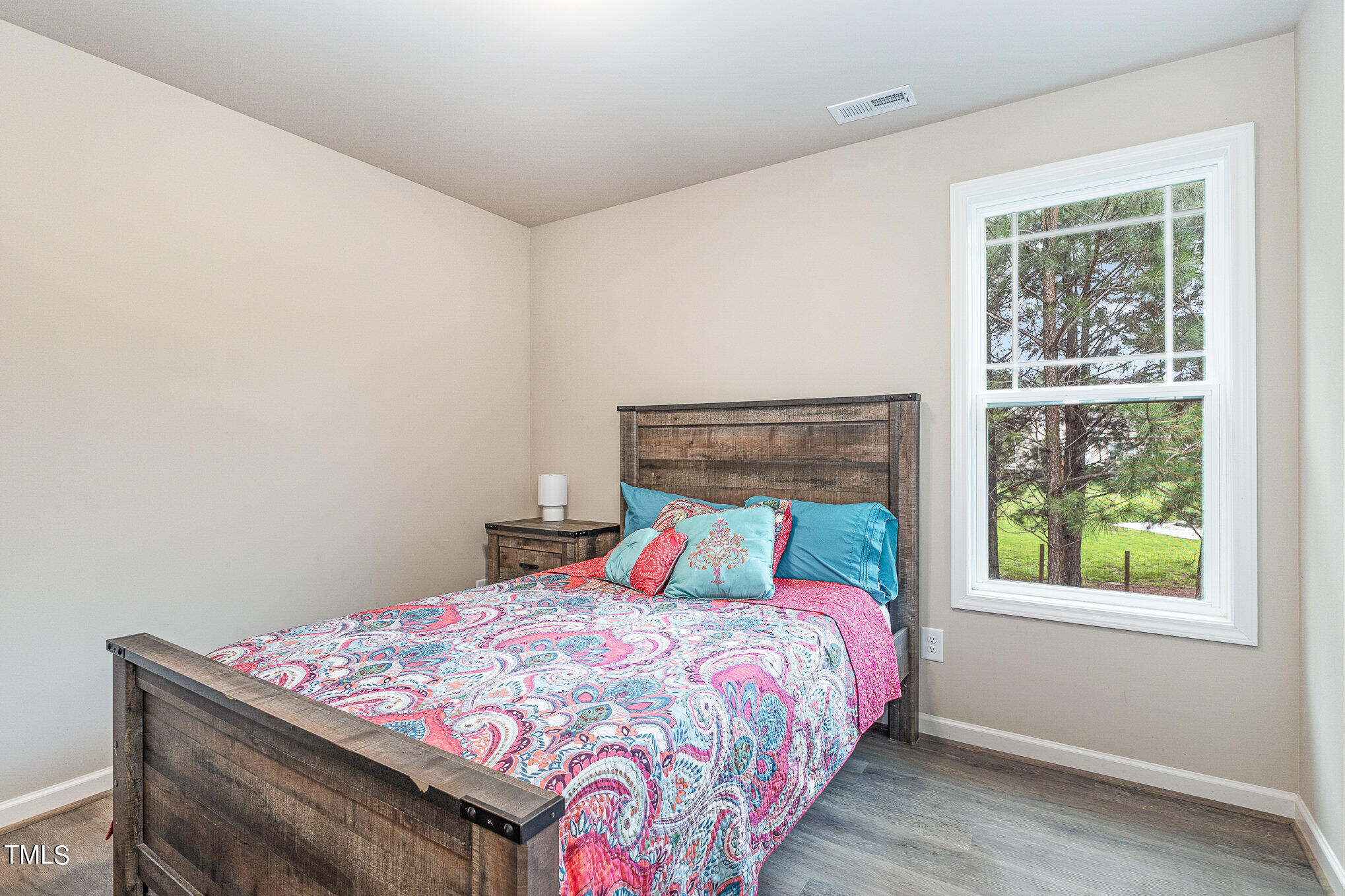 6005 Zacks Mill Road Angier, NC 27501 - Photo 15 of 23 a bedroom with a bed and a window