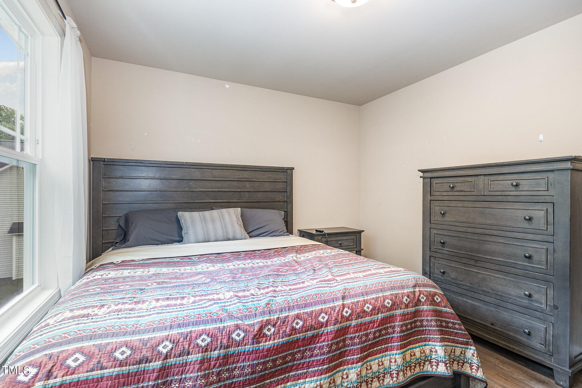 6005 Zacks Mill Road Angier, NC 27501 - Photo 16 of 23 a bedroom with a bed and a dresser