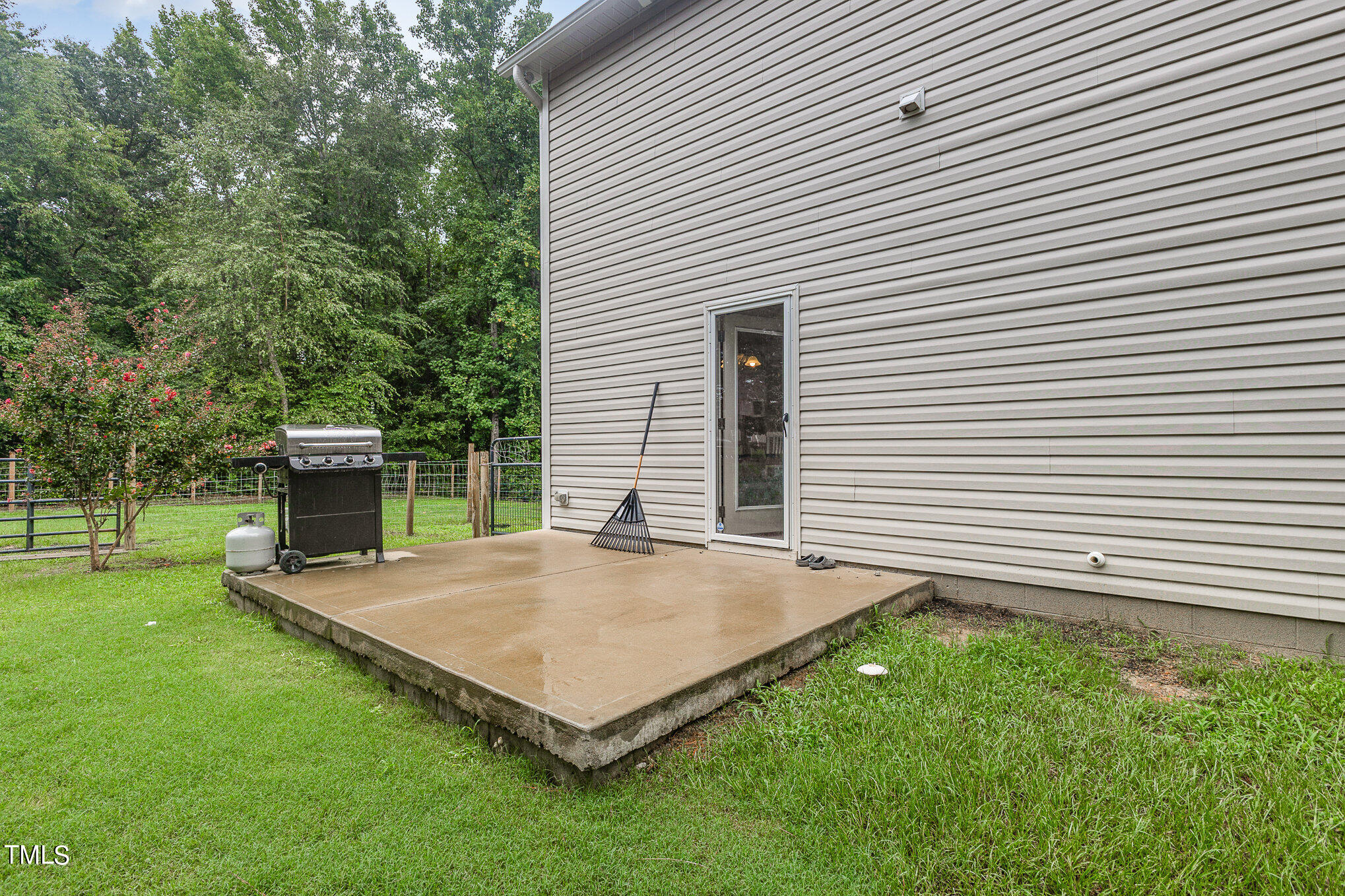 6005 Zacks Mill Road Angier, NC 27501 - Photo 20 of 23 a view of a backyard with a garden