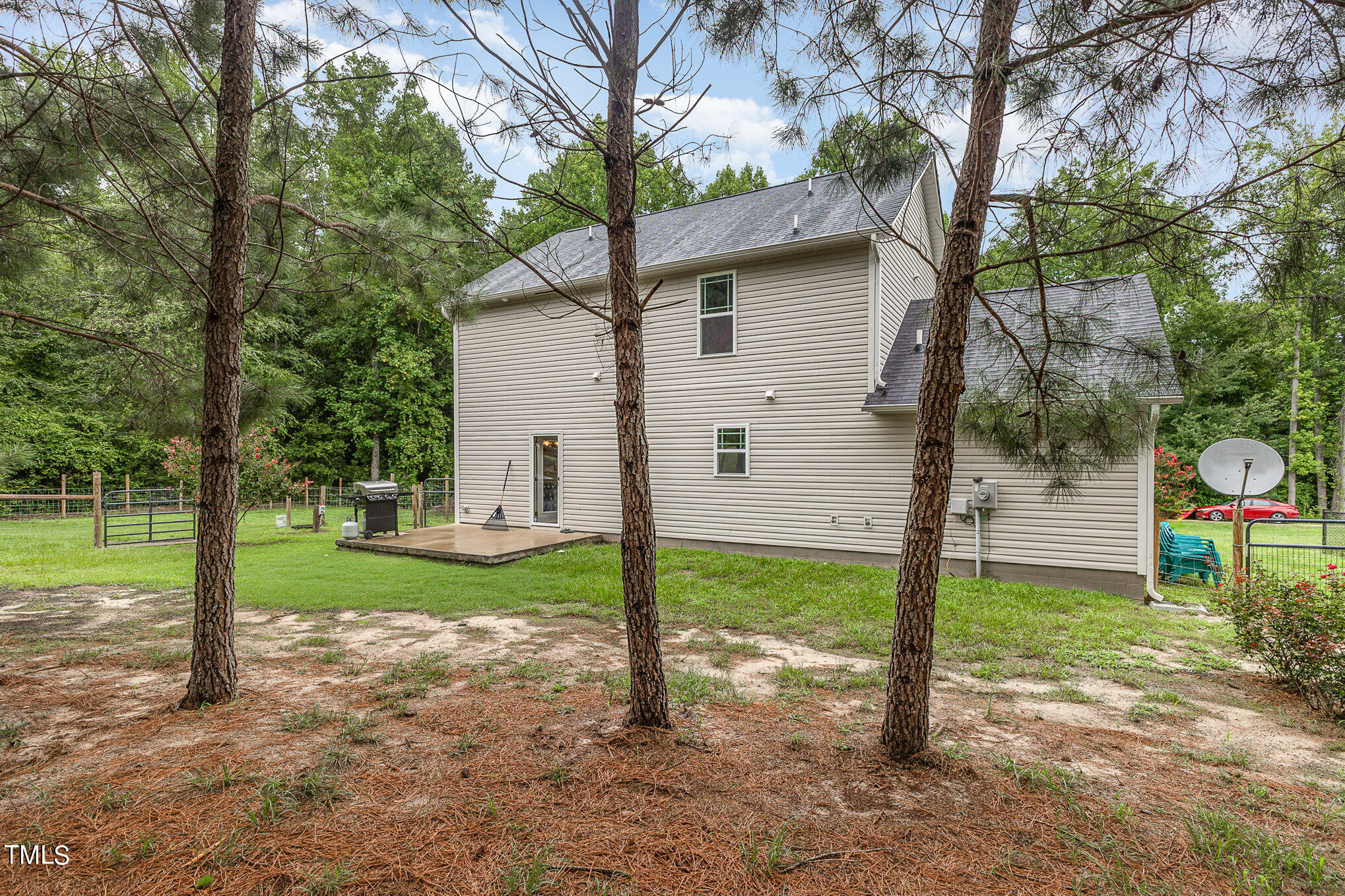 6005 Zacks Mill Road Angier, NC 27501 - Photo 23 of 23 a view of a house with backyard and a tree