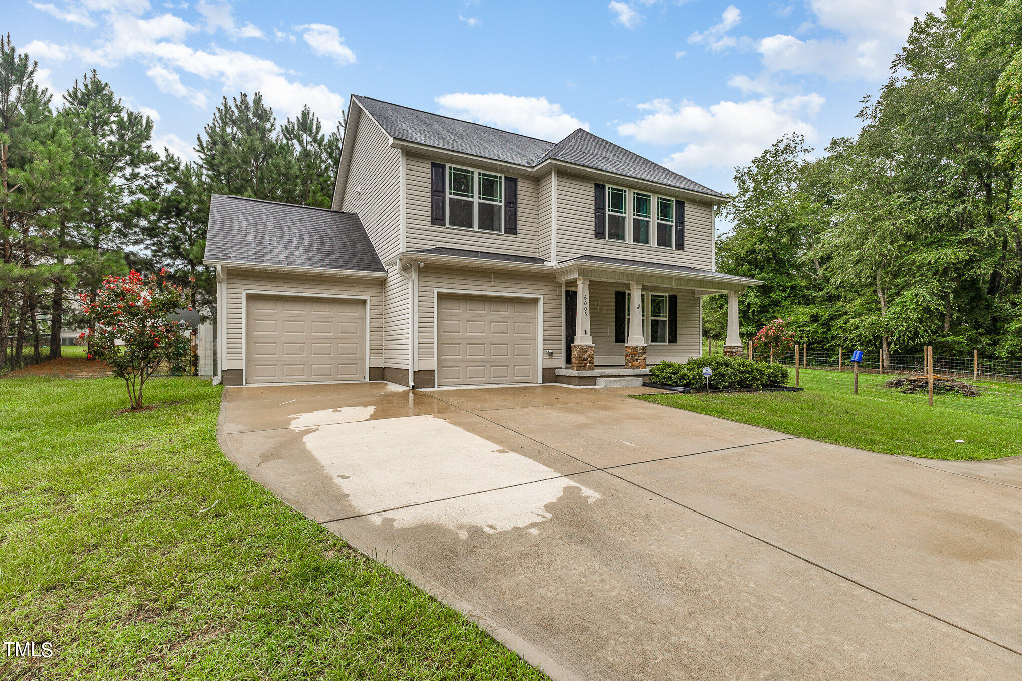 6005 Zacks Mill Road Angier, NC 27501 - Photo 3 of 23 a front view of a house with yard and green space