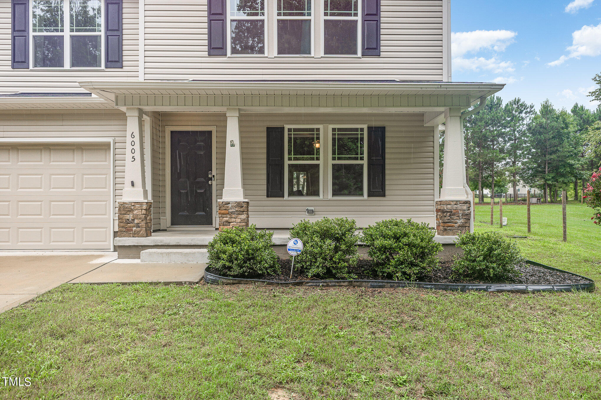 6005 Zacks Mill Road Angier, NC 27501 - Photo 4 of 23 a front view of a house with a yard