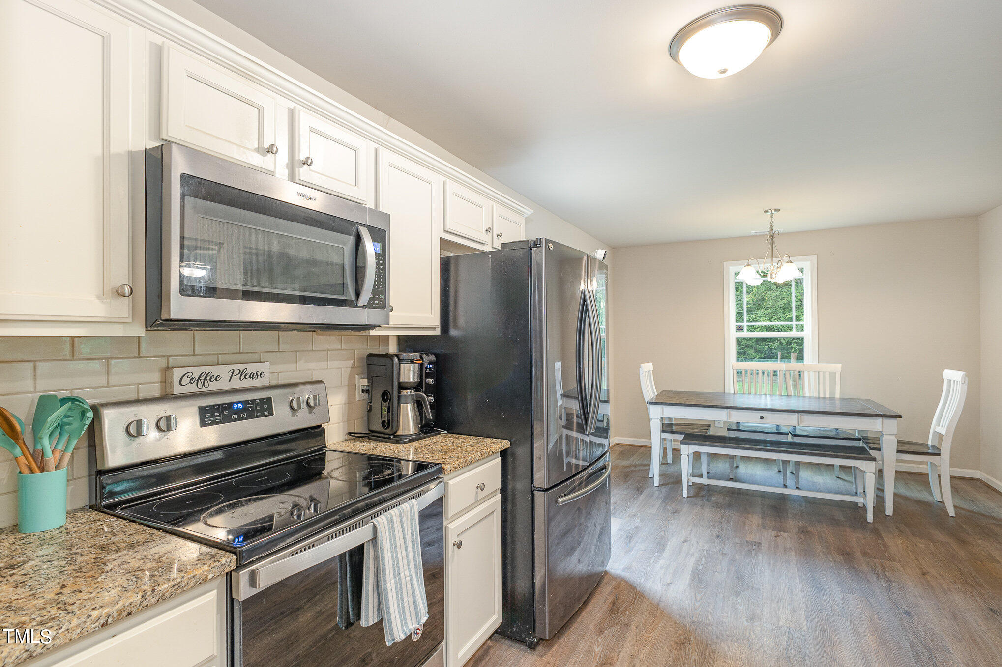 6005 Zacks Mill Road Angier, NC 27501 - Photo 10 of 23 a kitchen with wooden cabinets and stainless steel appliances