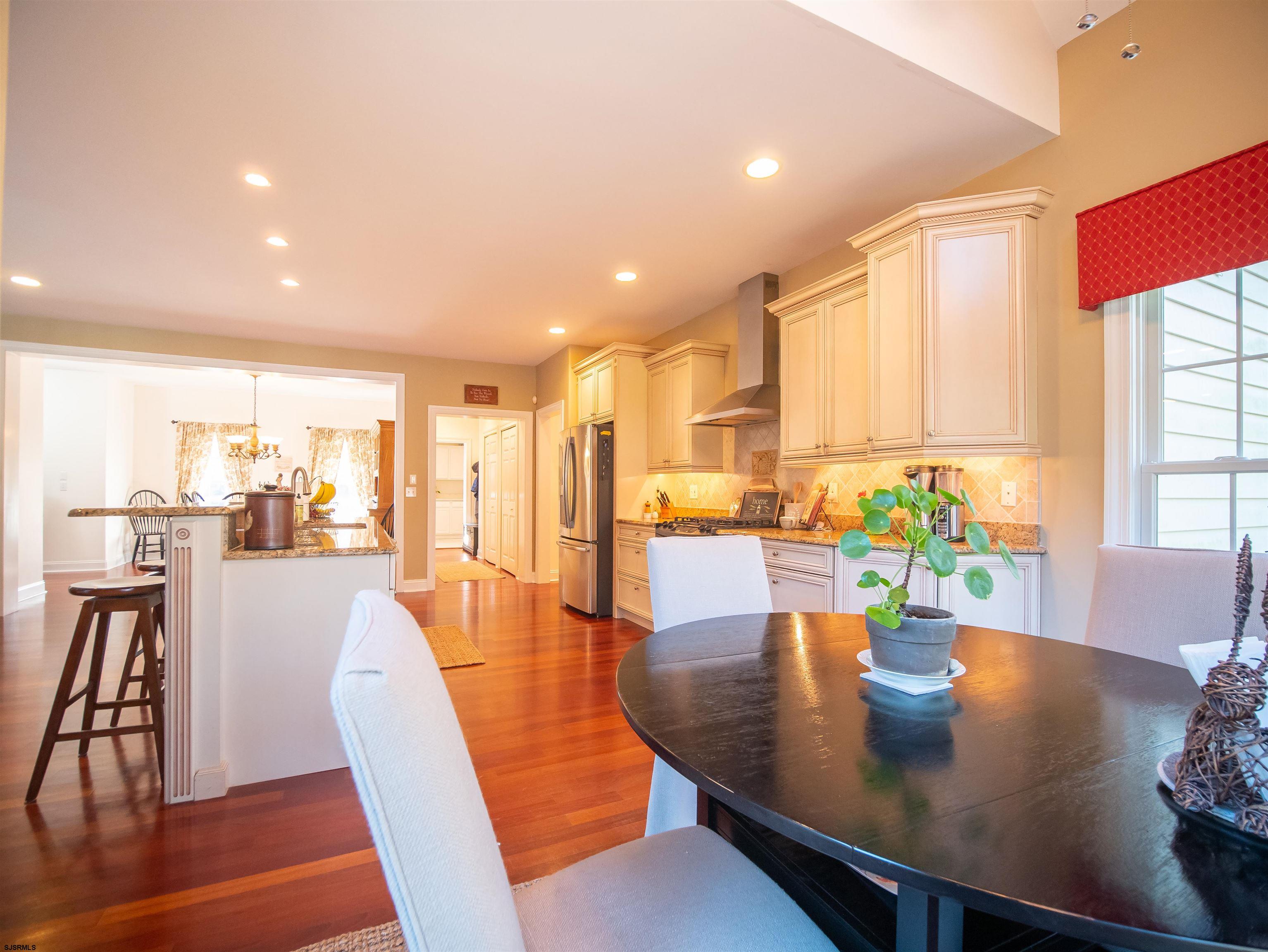 9 MGM Way Ocean View, NJ 08230 - Photo 17 of 61 a dining room with wooden floor and large windows