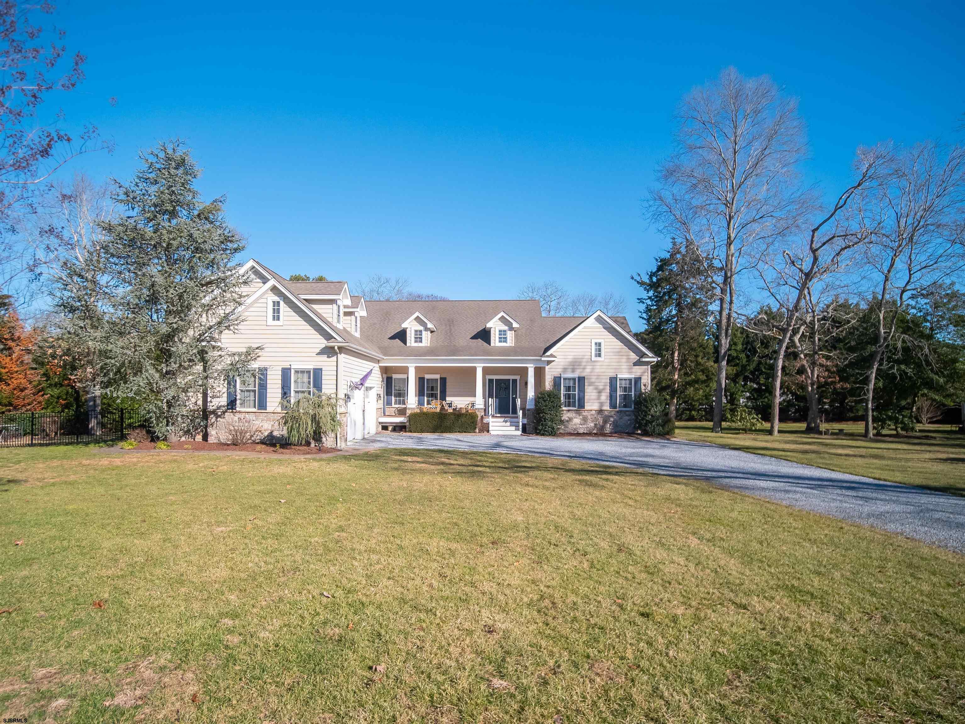 9 MGM Way Ocean View, NJ 08230 - Photo 2 of 61 a front view of a house with a yard