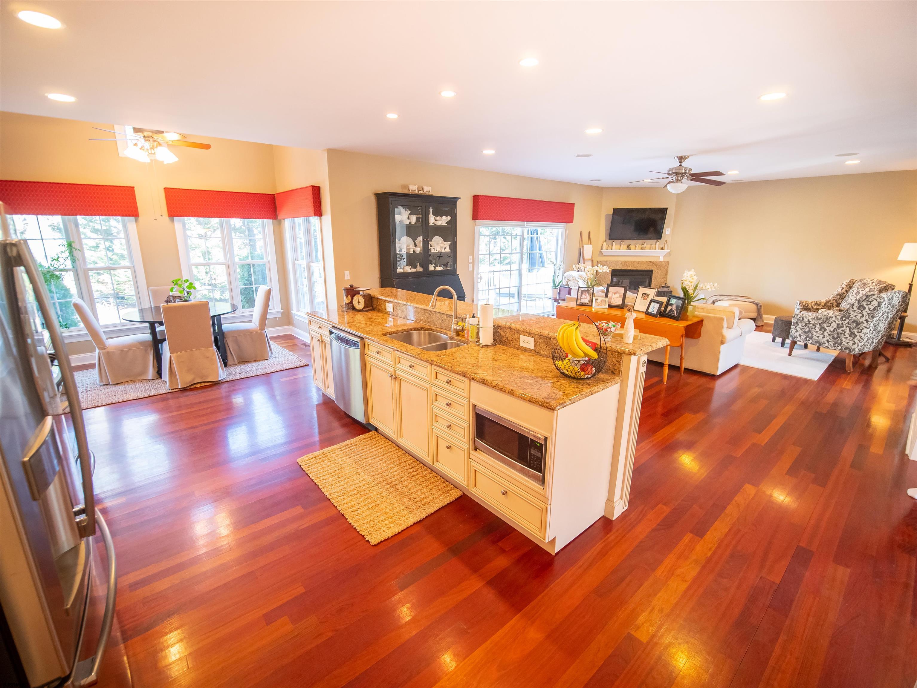 9 MGM Way Ocean View, NJ 08230 - Photo 24 of 61 a view of a living room with kitchen island furniture a rug kitchen view and a large window