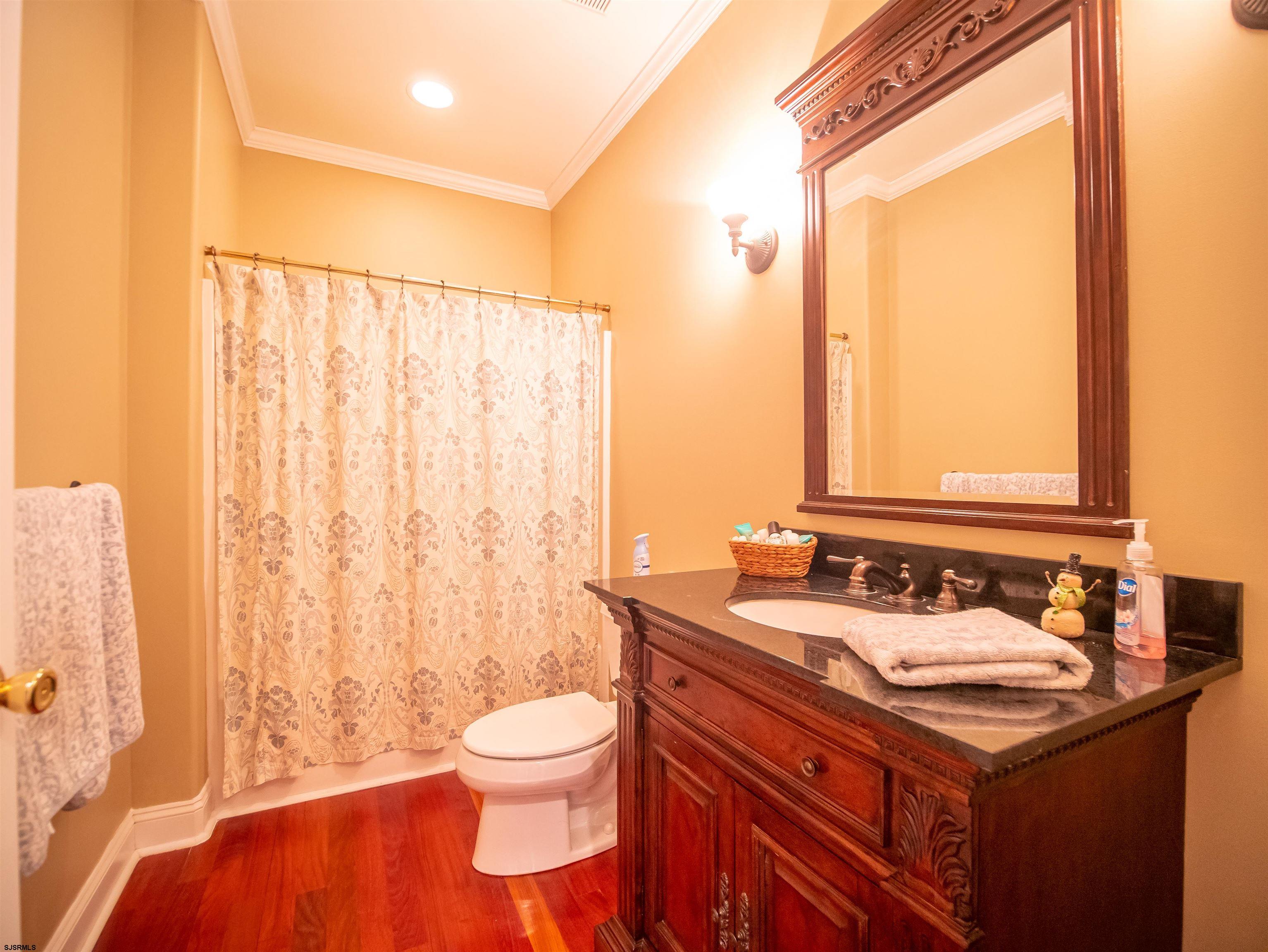 9 MGM Way Ocean View, NJ 08230 - Photo 25 of 61 a bathroom with a sink and a mirror